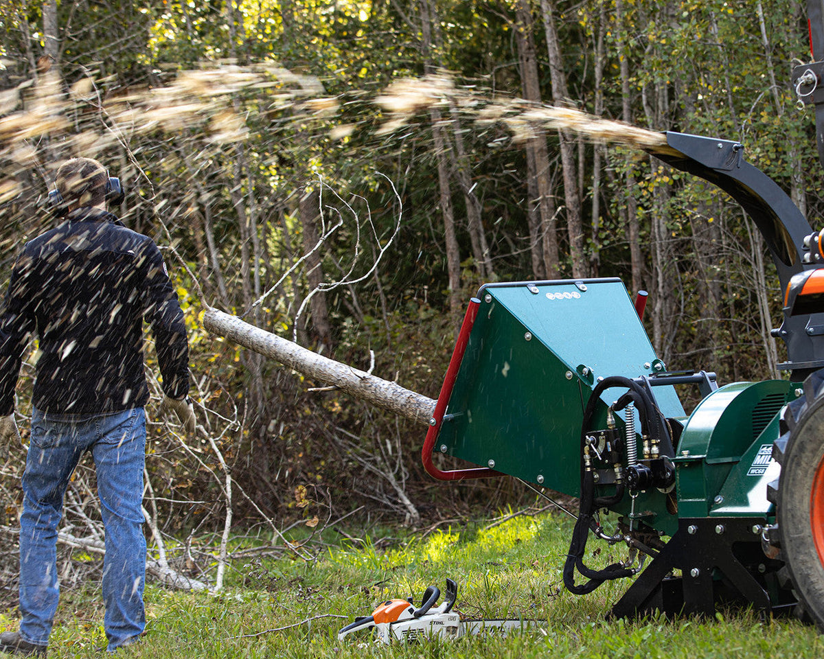 Wood chipper processing fresh branches and green material